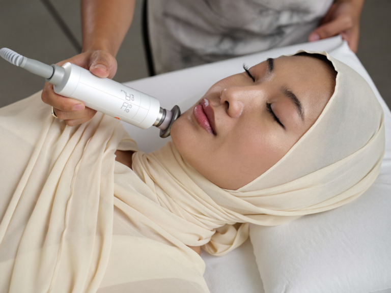 Indonesian woman in hijab receiving HIFU face treatment