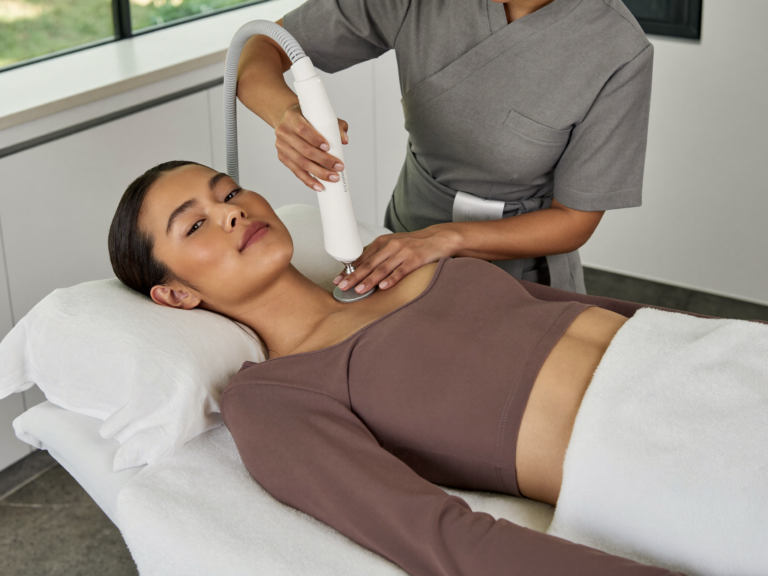 Indonesian woman without hijab receiving RF body contouring at Skinex clinic